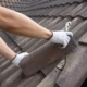 person repairing roof